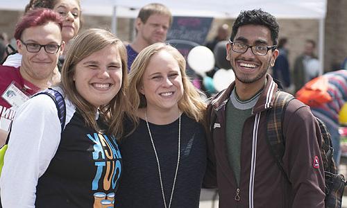 Students smiling at an outdoor event